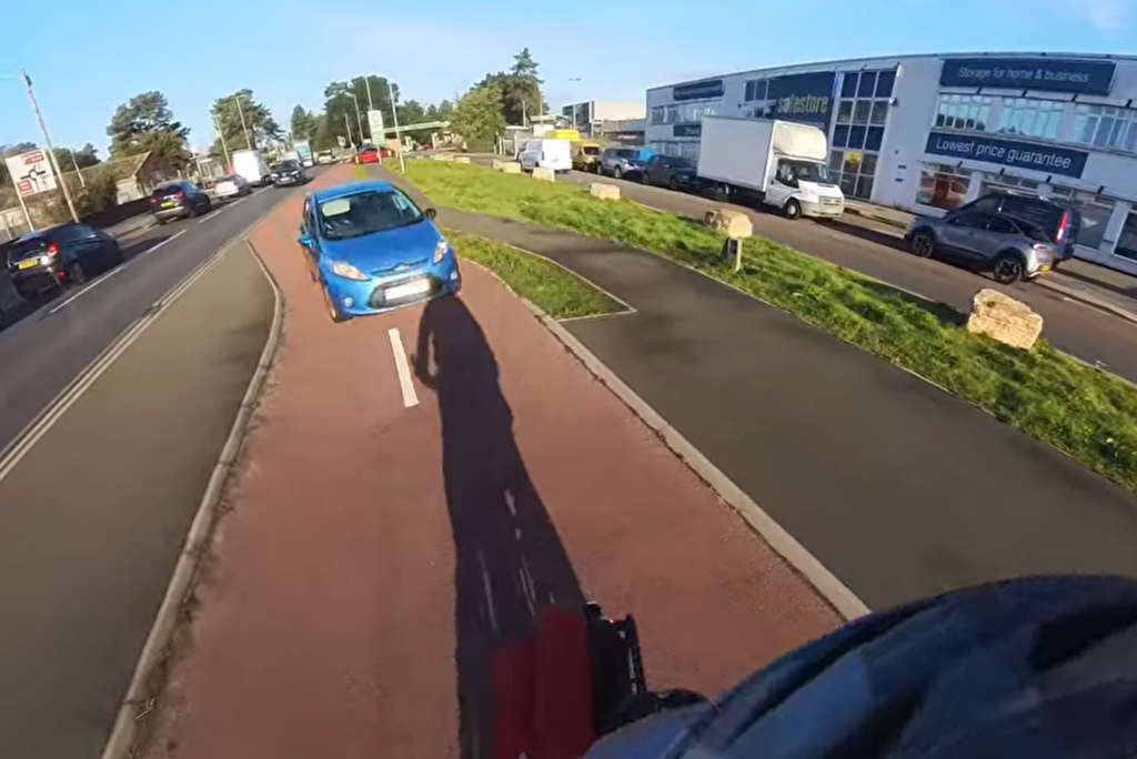 “You’re not on the road!” Camera cyclist stunned as motorist drives along protected cycle lane before blocking footpath to use sat nav