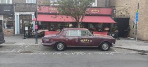 Café replaces bicycle billboard with car… blocking bike parking in the process + more on the live blog