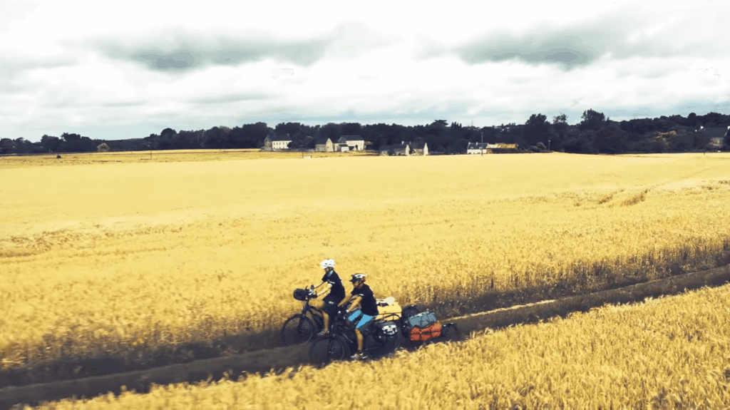 Corbetts ride through corn field – image via The Cycle Tourists.PNG