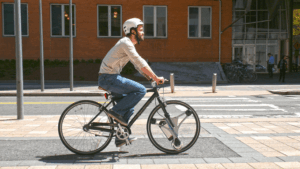 GeoOrbital CTO Dakota Decker using company&rsquo;s electric front wheel (source Kickstarter).png