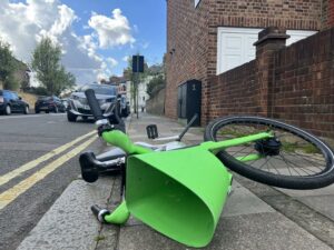 A Lime e-bike blocking the pavement in Langthorne Street, Fulham.jpg