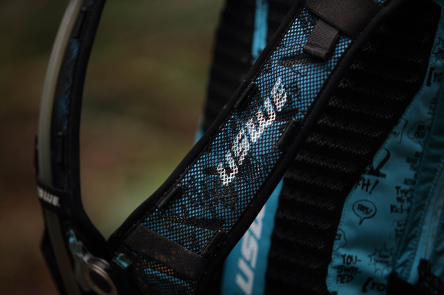 2022 USWE Shred 16 daypack logo strap.jpg
