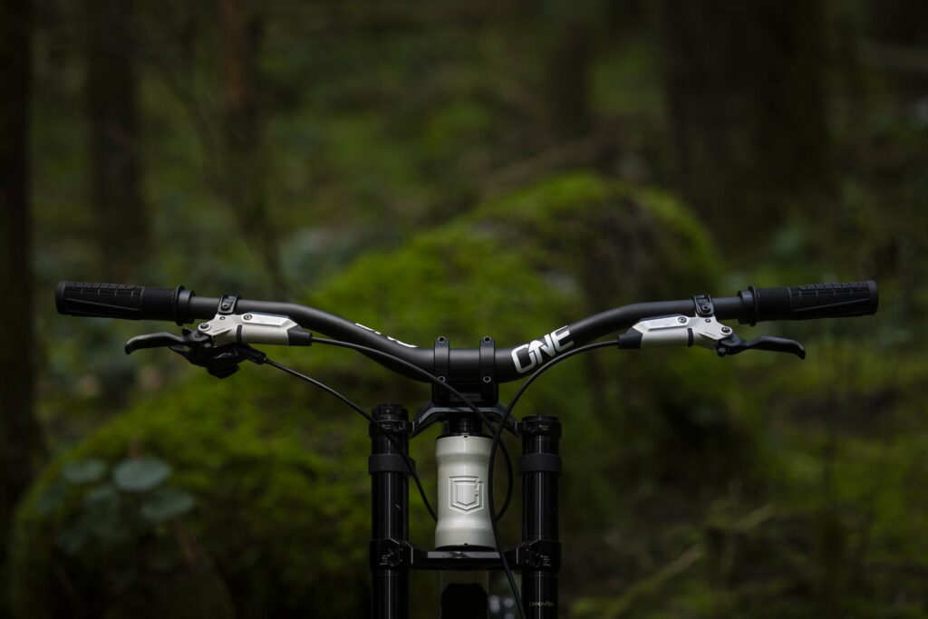 2025 oneUp Components V2 Carbon Handlebar riding hero.jpg