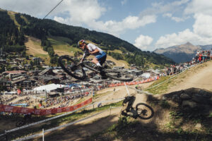 Tom Pidcock tail whips over gap jump at Les Gets, 2022 UCI MTB World Championships