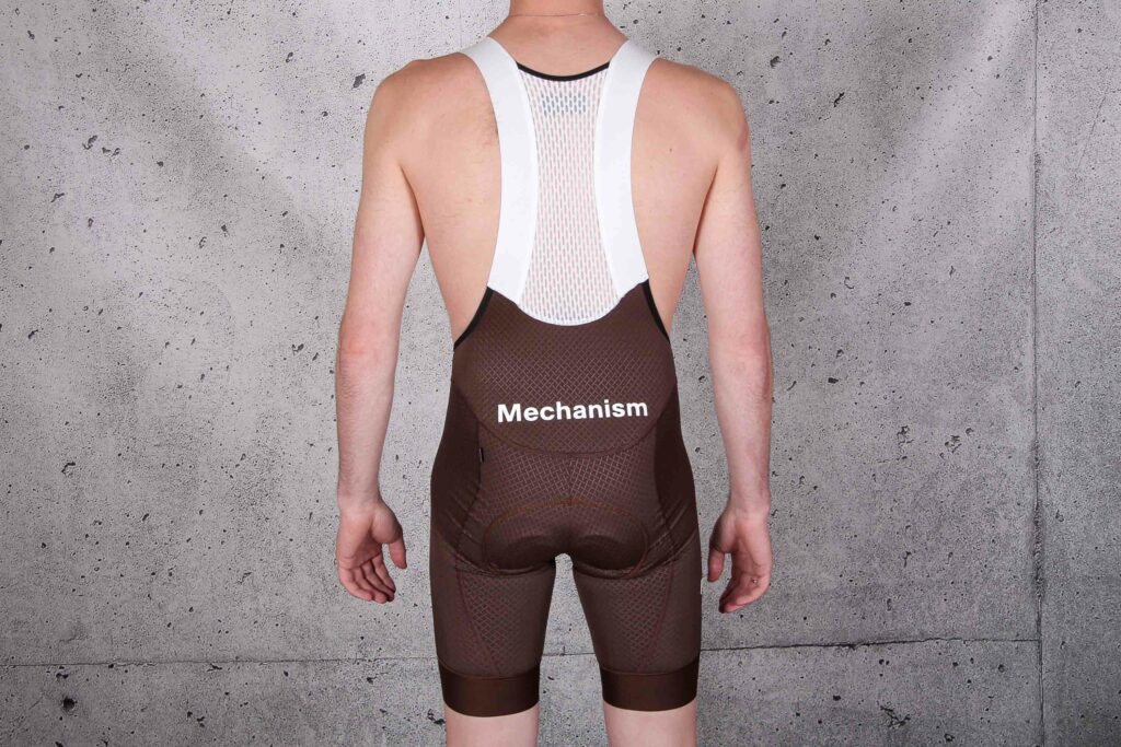 2022 Pas Normal Studios Men’s Mechanism Bibs – Bronze – back.jpg