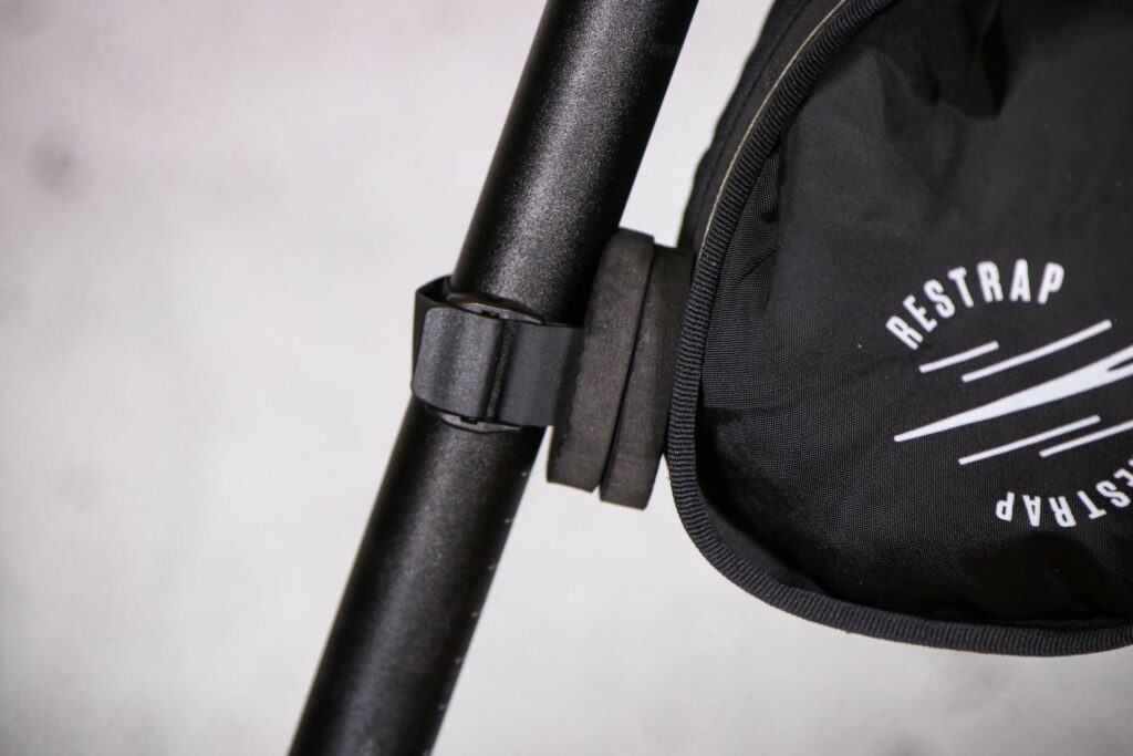 2022 Restrap Race Saddle Bag – seat post strap.jpg