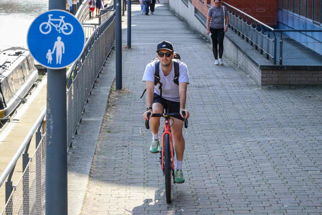 Commuting cyclist on shared use path