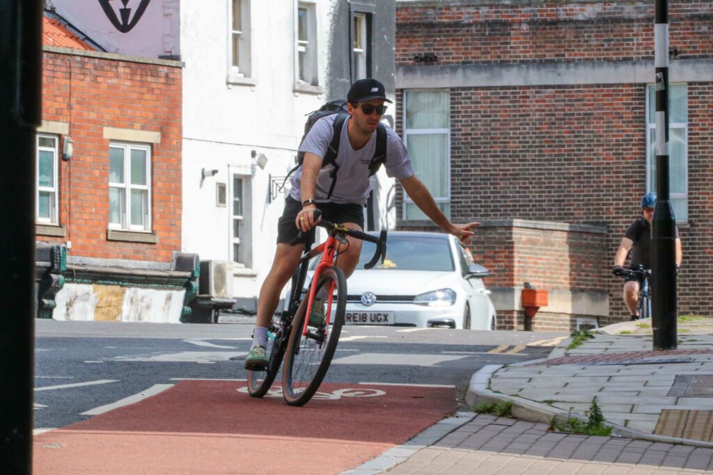 Commuting cyclist turning left 1.jpg