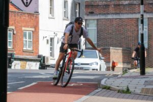 Commuting cyclist turning left 1.jpg