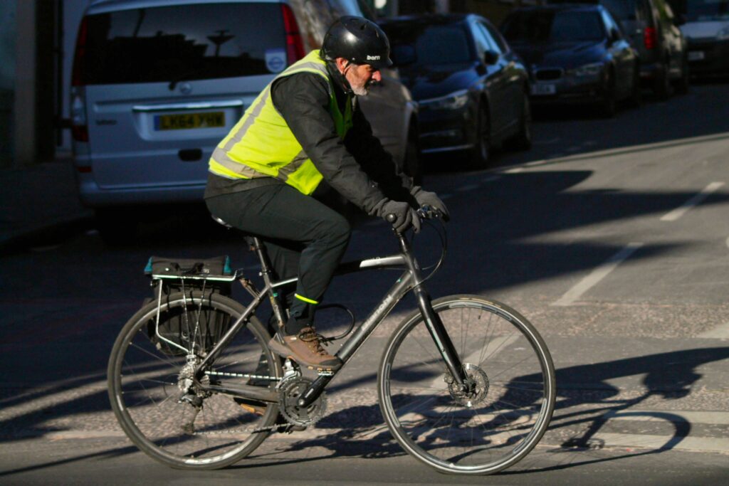 Cyclist in London bianchi and high-vis