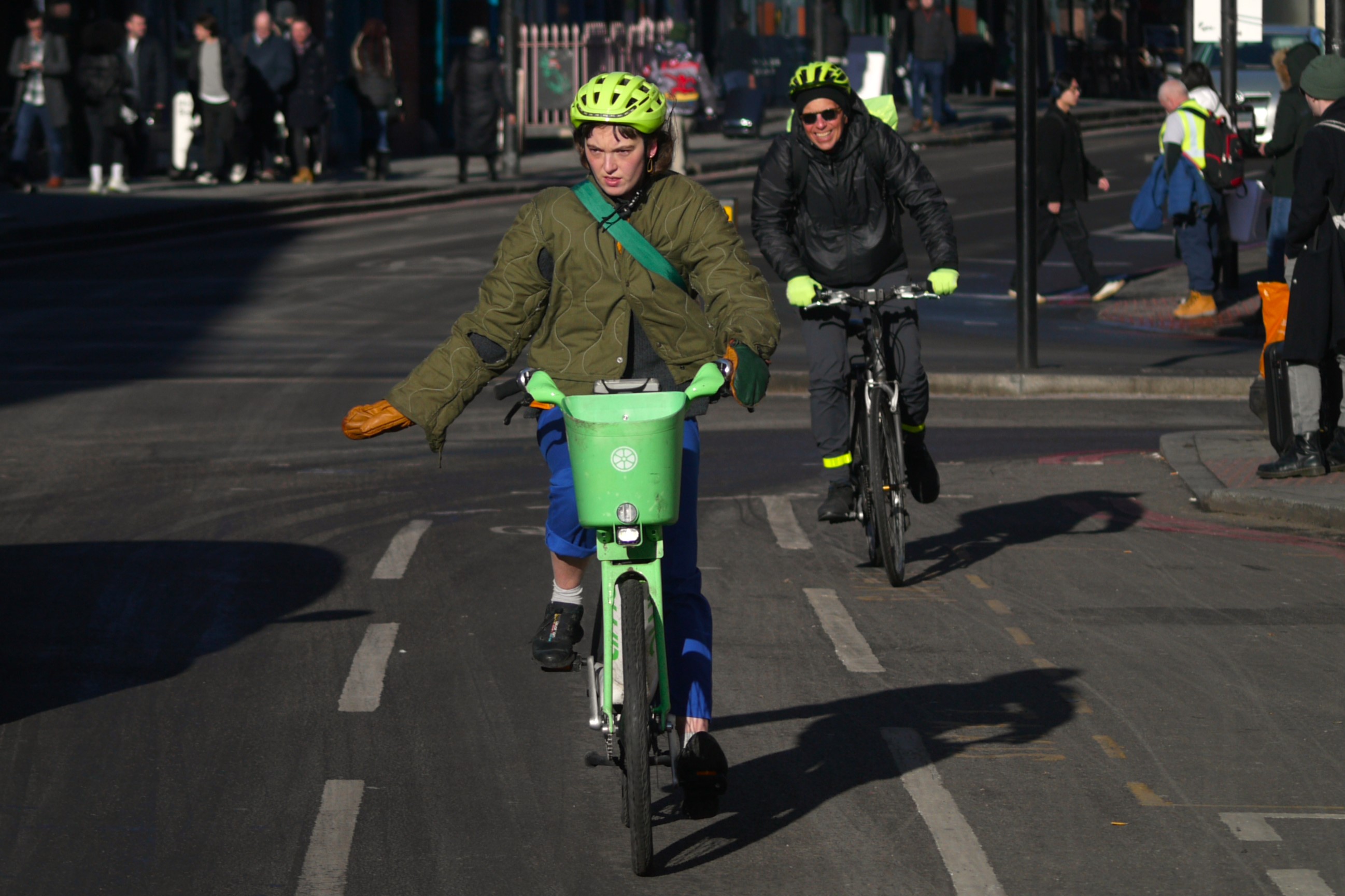 Cyclist in London indicating in cycle lane