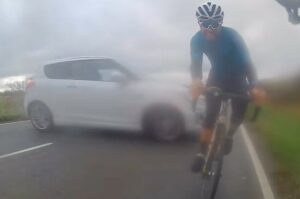 Cyclist narrowly avoids being hit by sideways driver