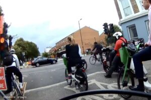 Cyclists waiting at traffic light, CS1, London