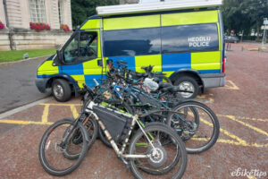 Seized e-bikes next to police car in Wales