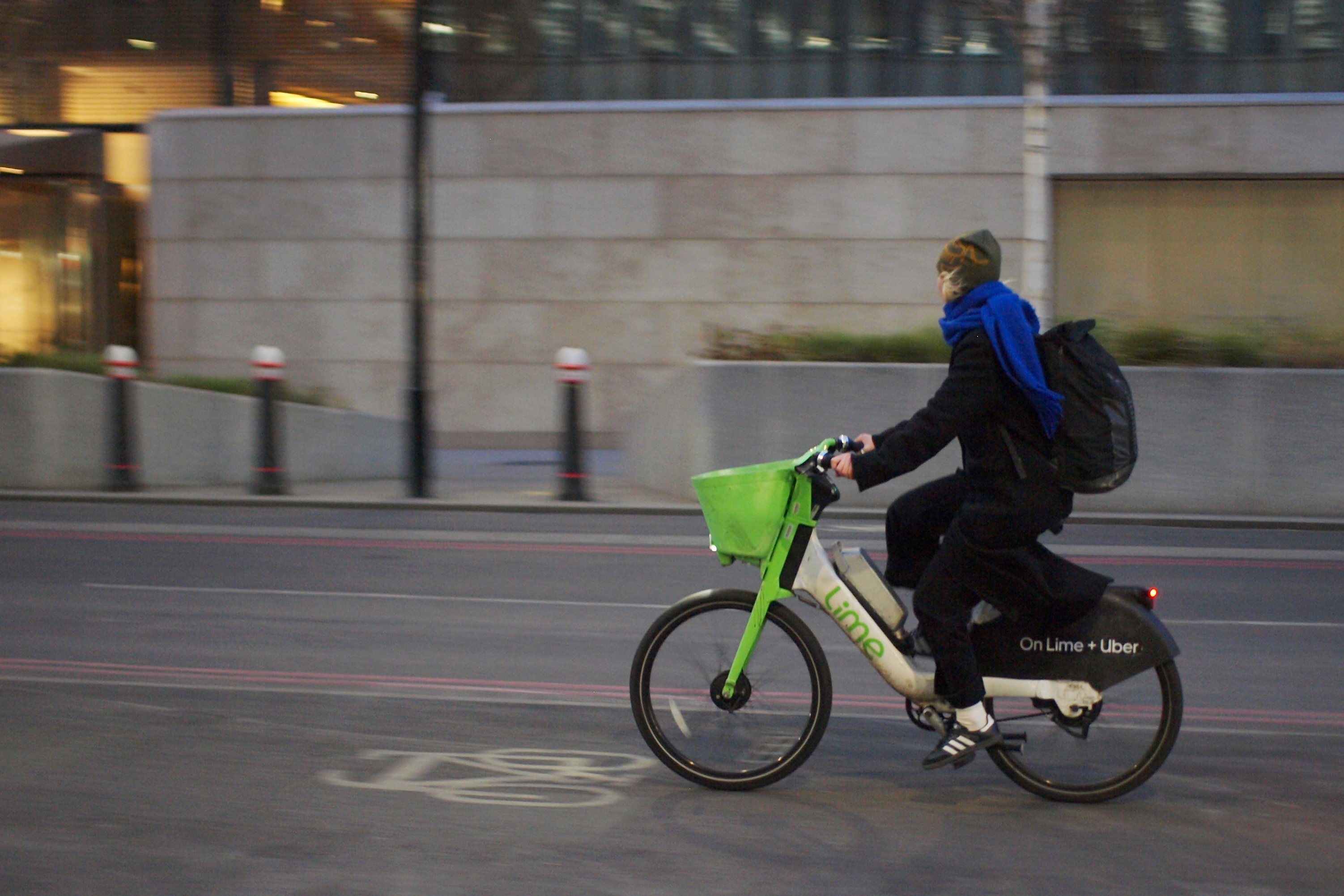 Cyclist in London riding Lime bike