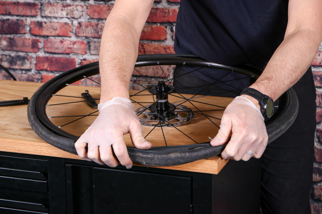 Fitting an inner tube &ndash; 22 &ndash; working on the final part of the tyre bead