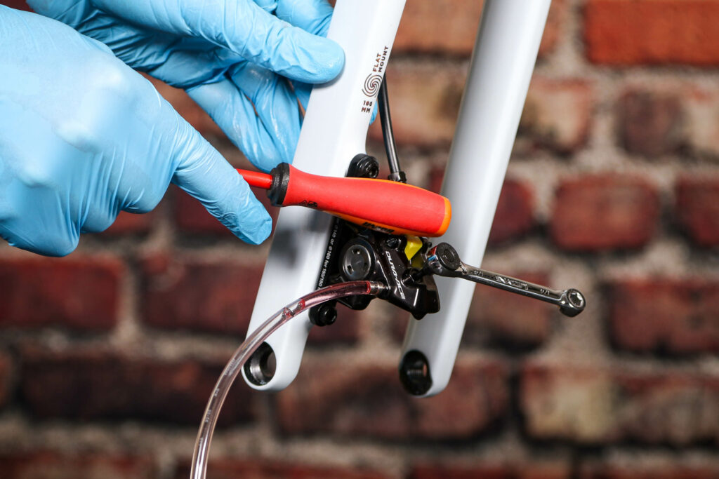 How to bleed Shimano hydraulic disc brakes &ndash; 21 &ndash; tapping the brake calliper