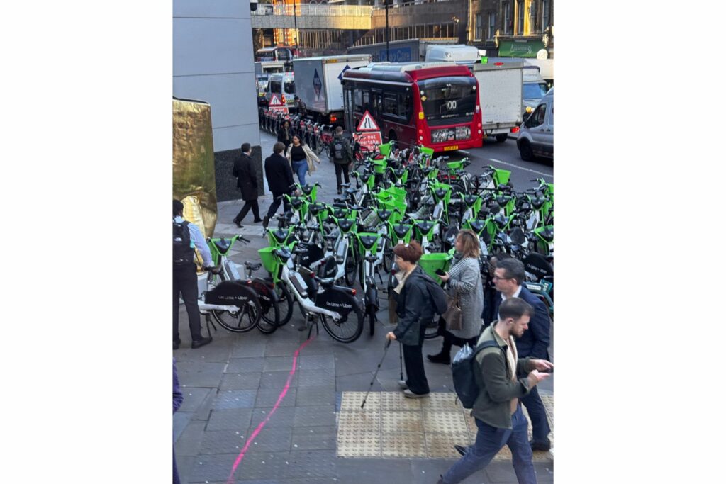 Lime bikes parked on the pavement in London