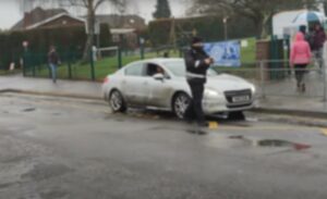 Motorist filmed receiving fine for parking on zig zag line outside school