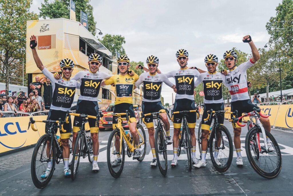 Geraint Thomas of Team Sky celebrates winning the 2018 Tour de France with team mates