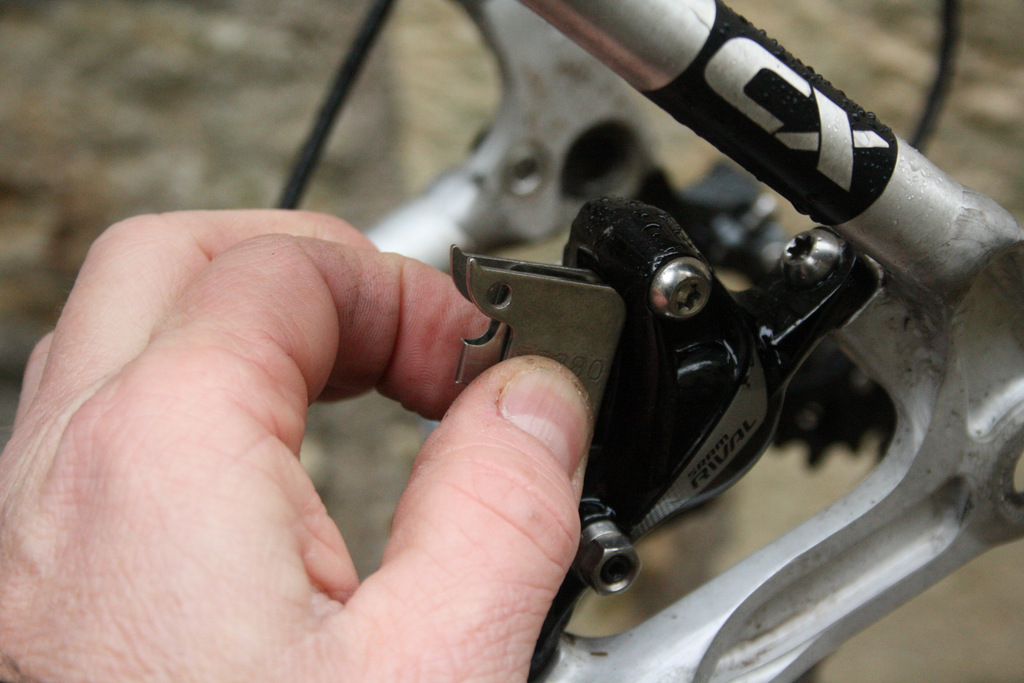Pinch pads and slide into calliper