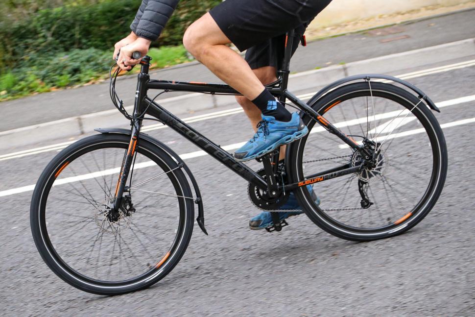 2021 Carrera Subway All Weather Edition Mens Hybrid Bike - riding 2.jpg