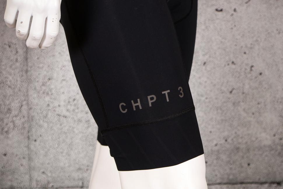 2021 CHPT3 Most Days Grand Tour Mens Bib Shorts - cuff logo.jpg
