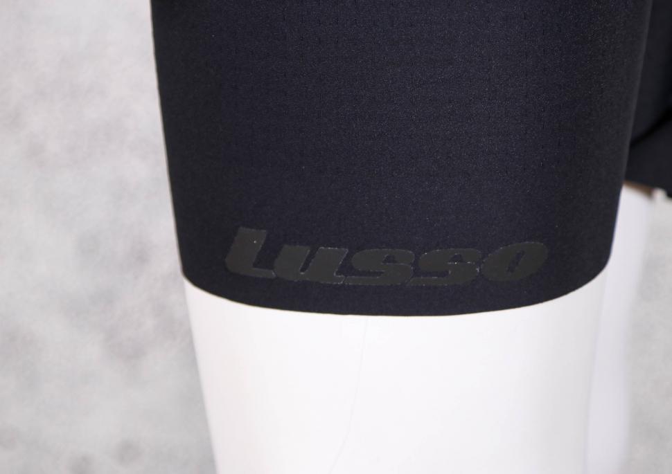 2021 Lusso Comfort break Bibshorts - cuff logo.jpg