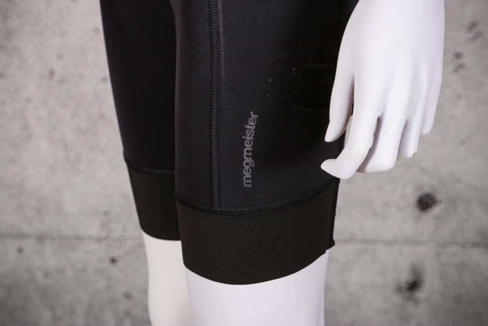 2021 Megmeister Womens L8 Bib Shorts - cuff logo.jpg