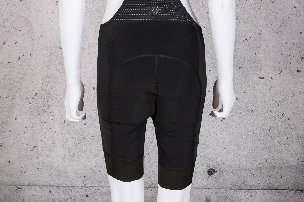 2021 Megmeister Womens L8 Bib Shorts - legs back.jpg