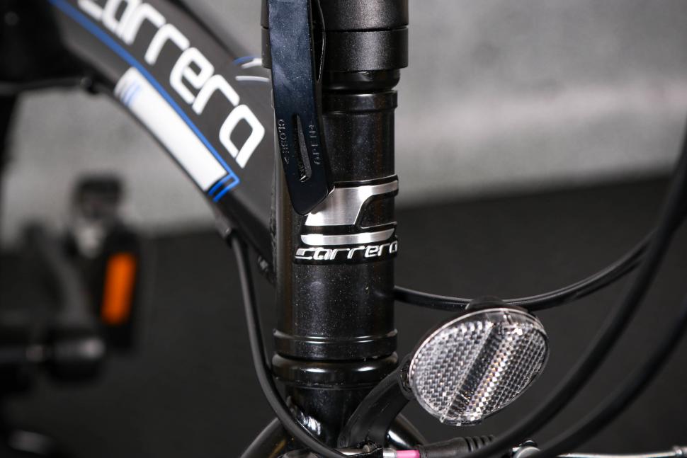 2022 Carrera Intercity Folding Bike - head tube badge.jpg