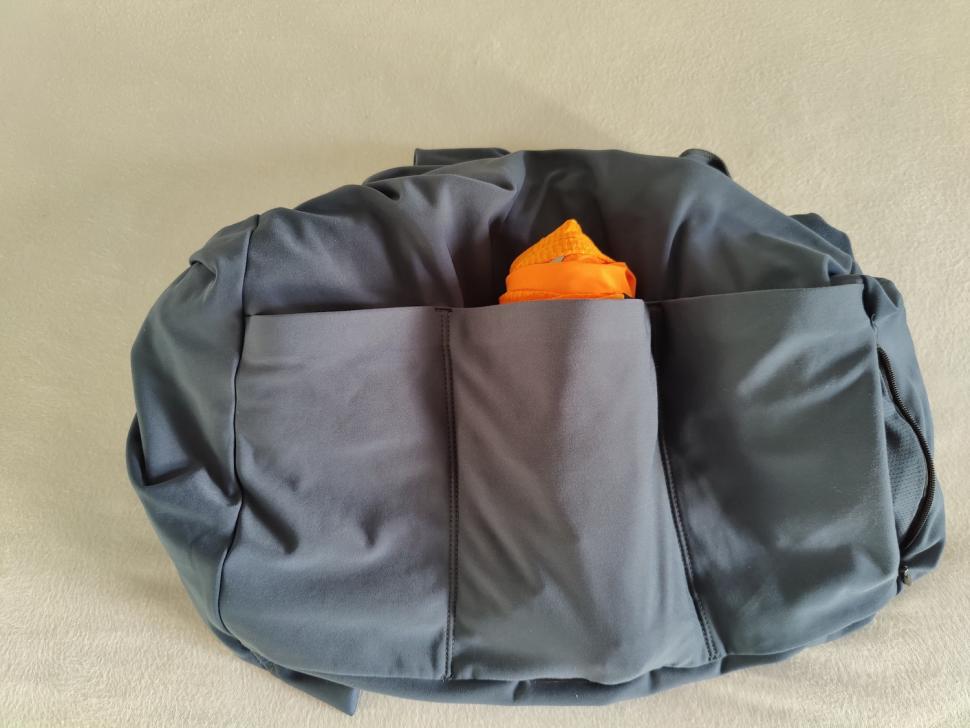 2022 Le Col Pro Wind Jacket rolled in pocket.jpg