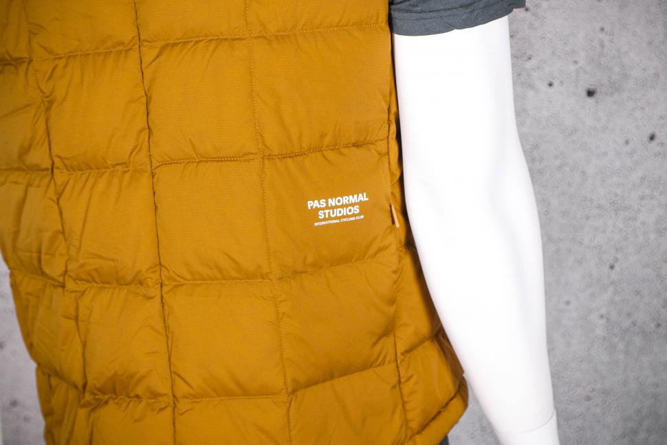 2022 Pas Normal Studios Men's Escapism Down Vest - back detail.jpg