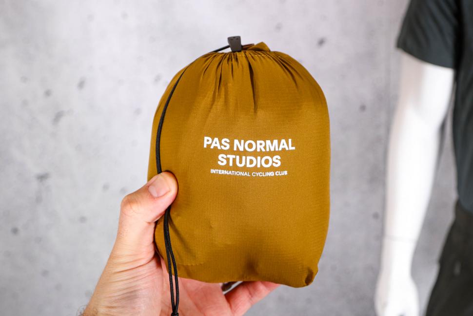 2022 Pas Normal Studios Men's Escapism Down Vest - pouch.jpg