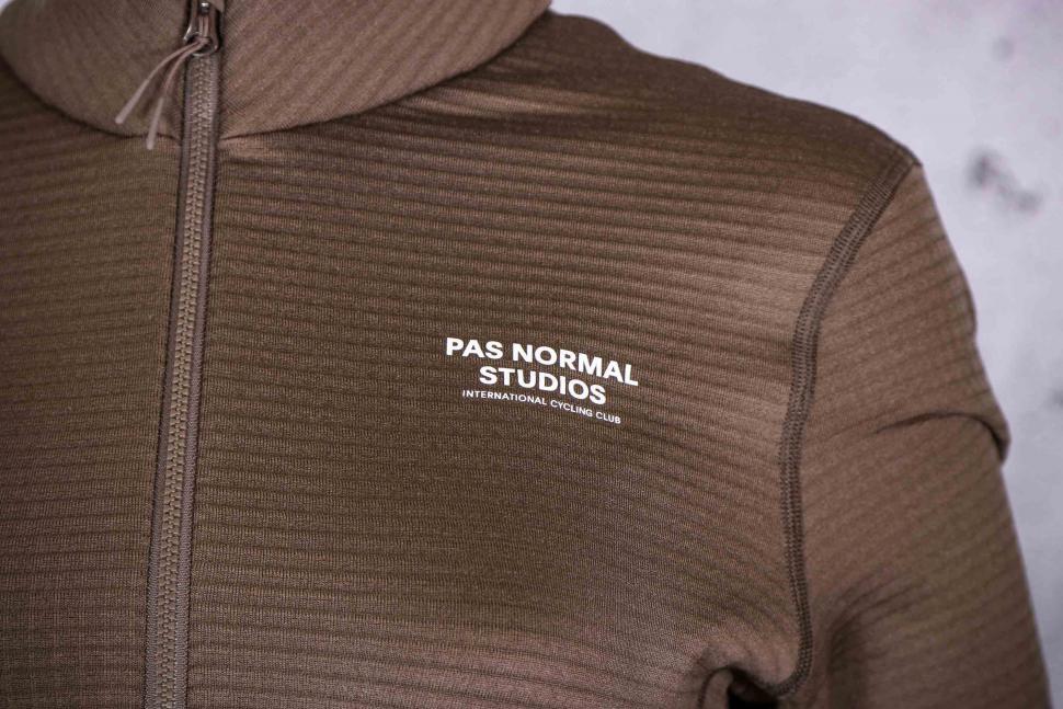 2022 Pas Normal Studios Women's Escapism Performance Fleece Zip - logo front.jpg