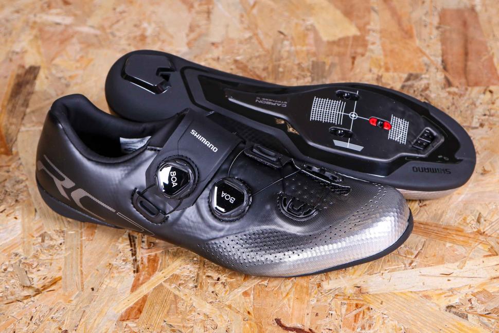 Black Shimano RC7 (RC702) SPD-SL Shoes on wooden background
