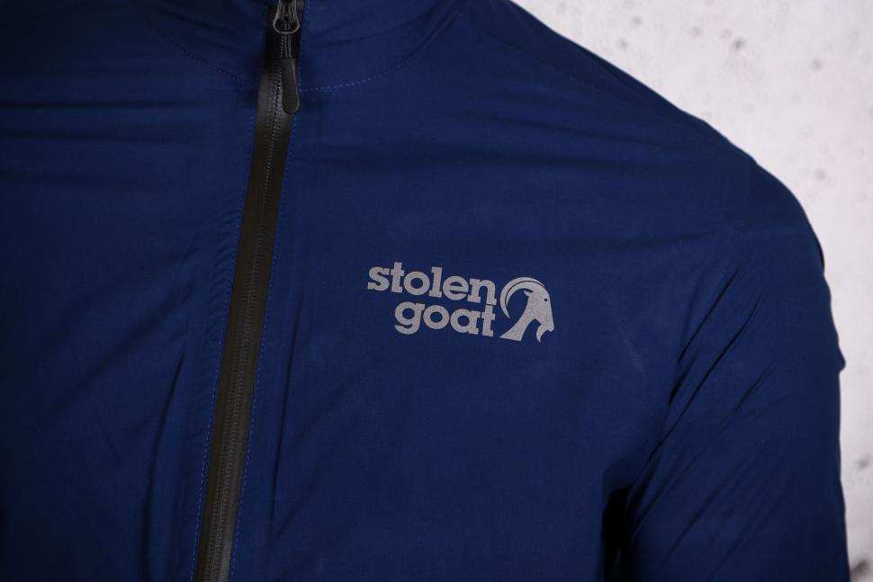 2022 Stolen Goat Men's Navy Waterproof Jacket - chest logo.jpg