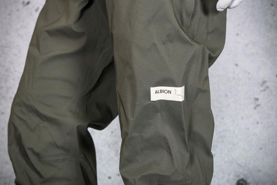 2023 Albion Zoa Rain Trousers - leg logo.jpg