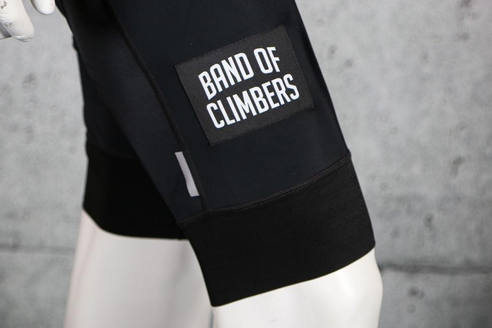2023 Band of Climbers Empire Bib Shorts - leg logo.jpg