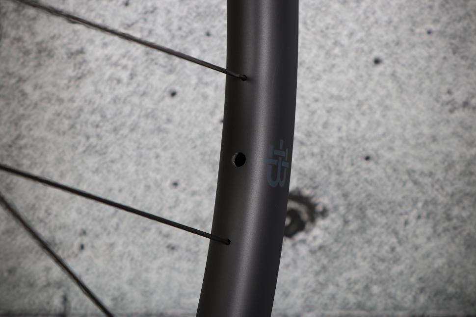 2023 Black Inc Thirty wheelset - valve hole.jpg