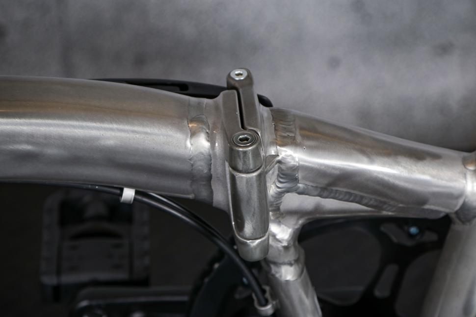 2023 BTwin Ultra compact 1 second light folding bike - frame hinge.jpg