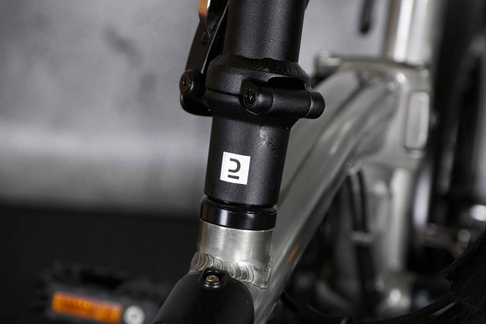 2023 BTwin Ultra compact 1 second light folding bike - head tube logo.jpg