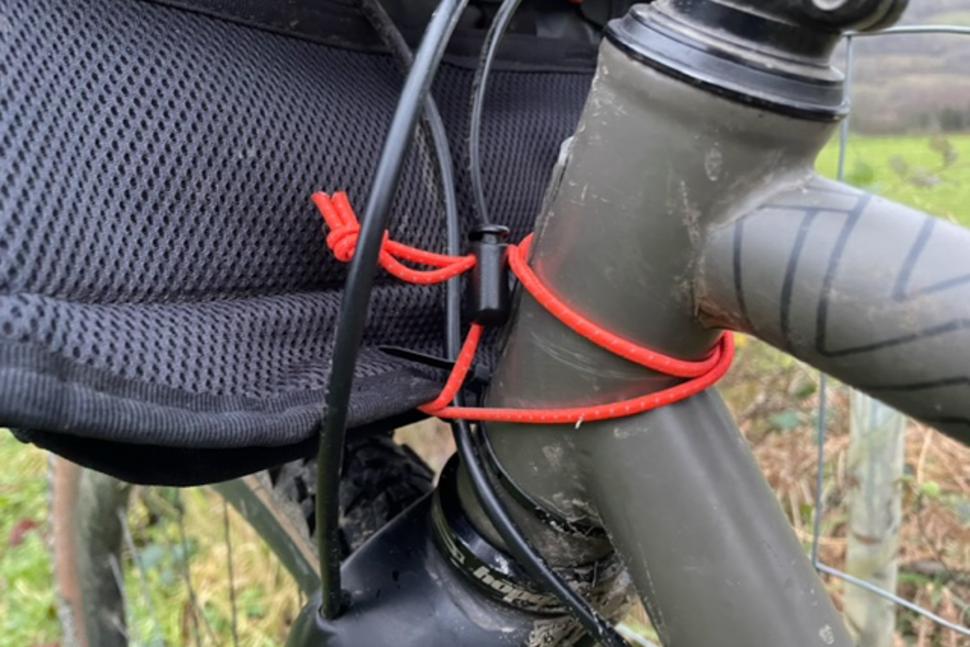 2023 Restrap Utility Hip Pack - head tube bungee.jpg