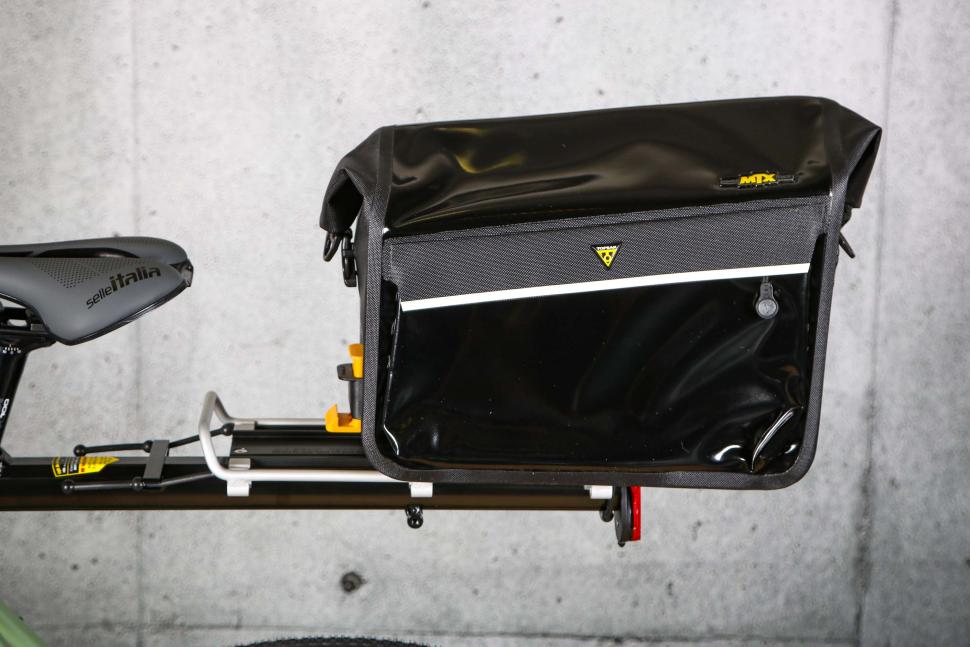 2023 Topeak DryBag MTX Trunk Bag - sliding in to rack 2.jpg