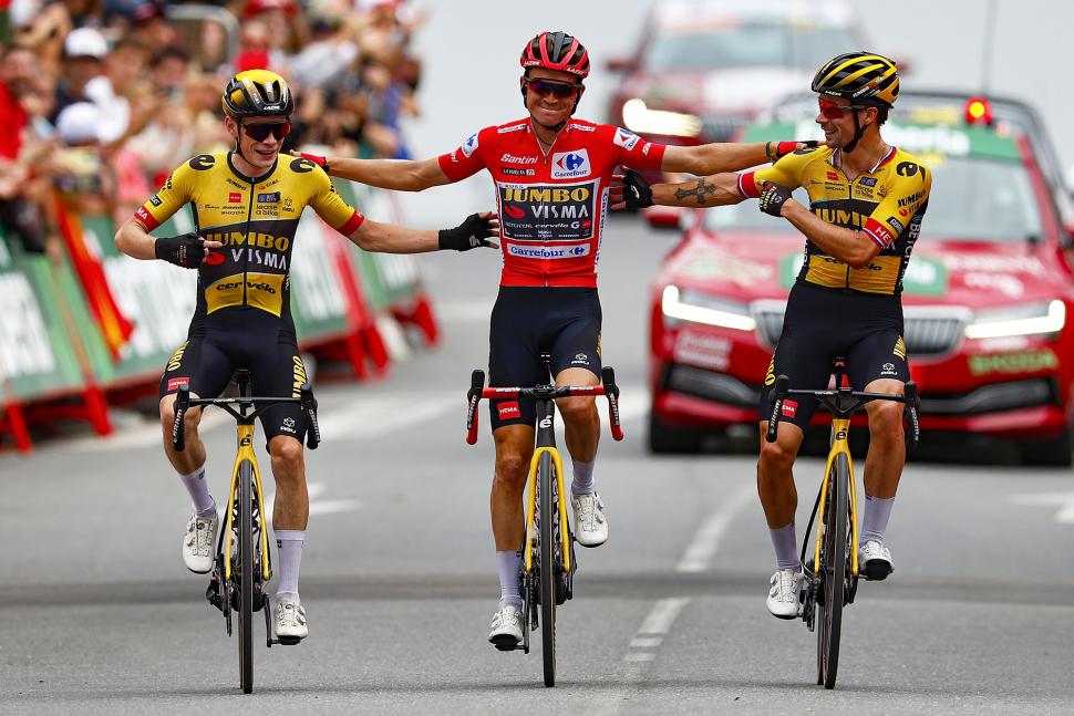 Sepp Kuss, Jonas Vingegaard, and Primož Roglič cross the line together on stage 20 of the 2023 Vuelta a Espa&ntilde;a (Rafa Gomez/SprintCyclingAgency)