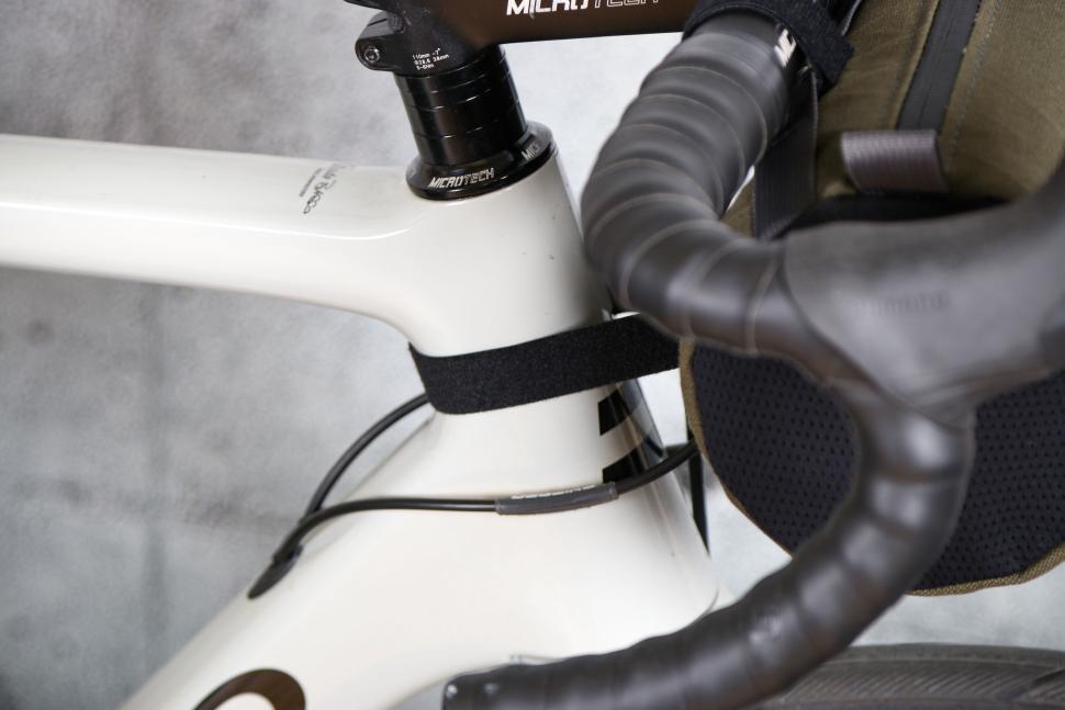 2024 Alpkit Top Loader 4L Canister Handlebar Bag - head tube strap.jpg