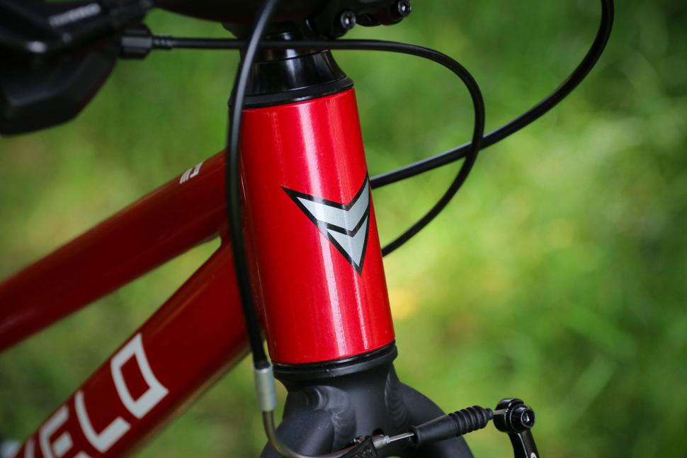 2024 Prevelo Alpha Three 20-inch - head tube badge.jpg