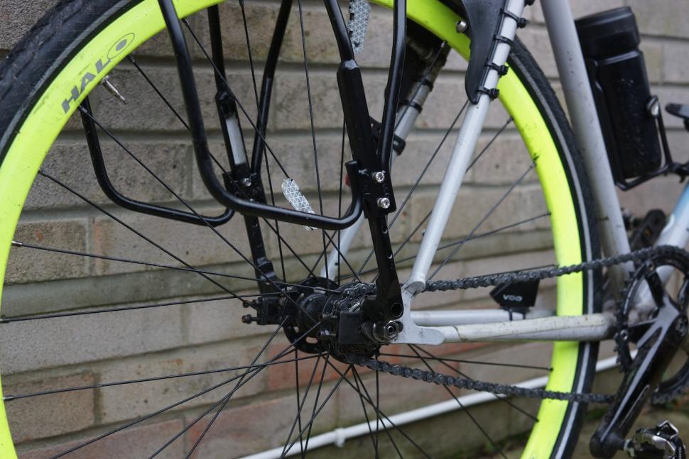 2024 Topeak Uni Super Tourist DX Disc mounts & adjustment view of unpainted internal tubing.JPG