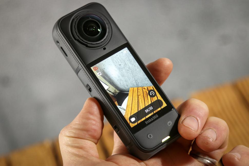 2025 Insta360 X5 Action Camera - in hand screen on.jpg