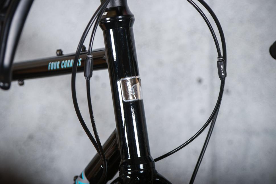 2025 Marin Four Corners 1 Sword - head tube badge.jpg